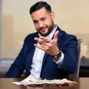 Commercial Cap Rate Calculator Mortgage broker showing commercial cap rate returns with cash on desk